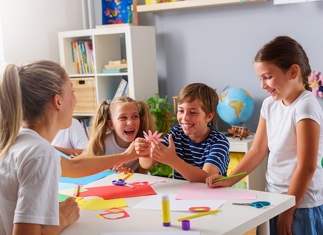 In-home Daycare Insurance - Happy Family at Mother Learning and Playing at Home